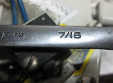 7/16 inch open end wrench required