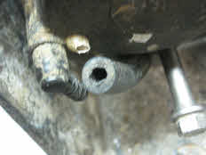 Remove water pump tube from case