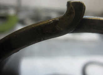 W Broken spring end can be seen with out taking unit apart